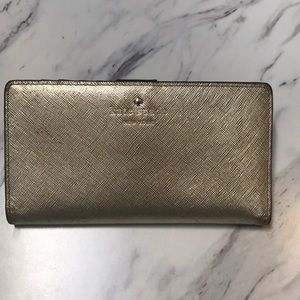 Bright gold Kate Spade New York wallet very used